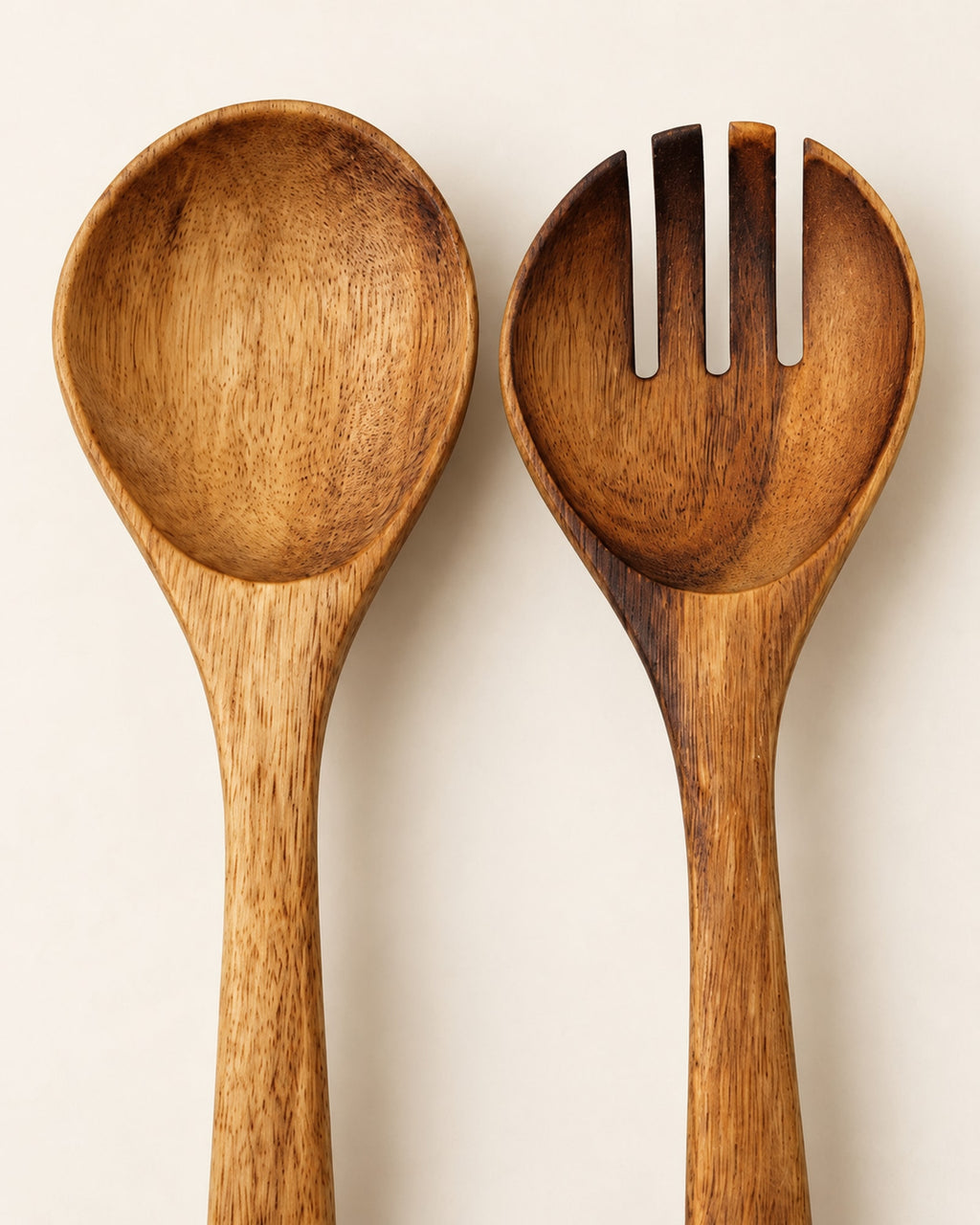Close-up of the fork tines and spoon showing the acacia grain.
