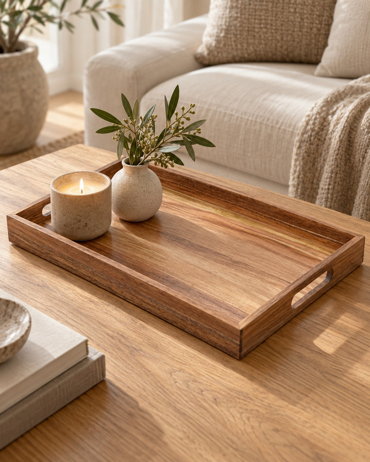 Acacia tray on an oak coffee table with a candle and a small vase. Accessories not included.