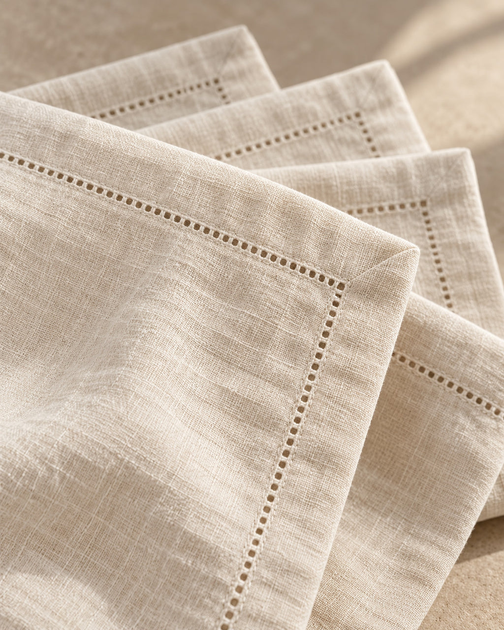 Close-up of the hemstitched border and washed linen texture.