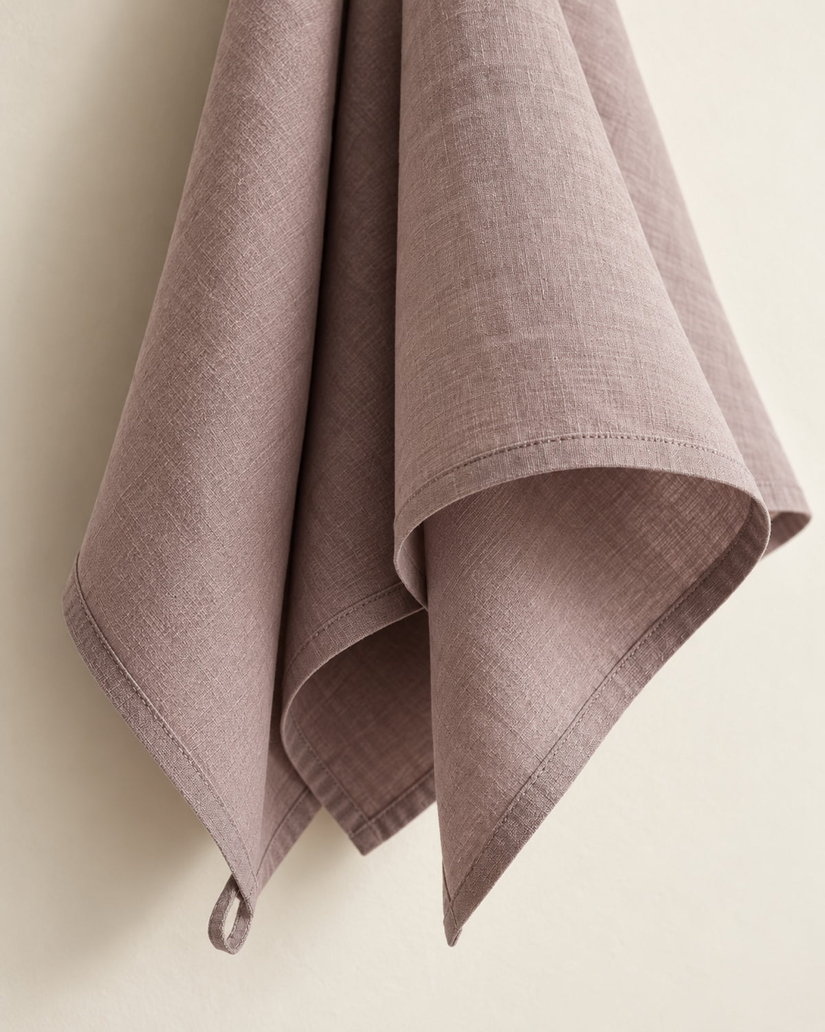 Close-up of the washed linen texture and hem.