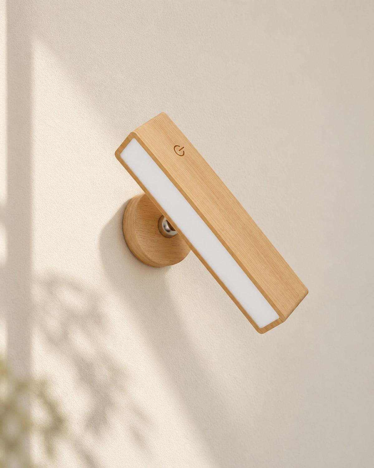 Rechargeable beech wood wall reading lamp on a plain wall