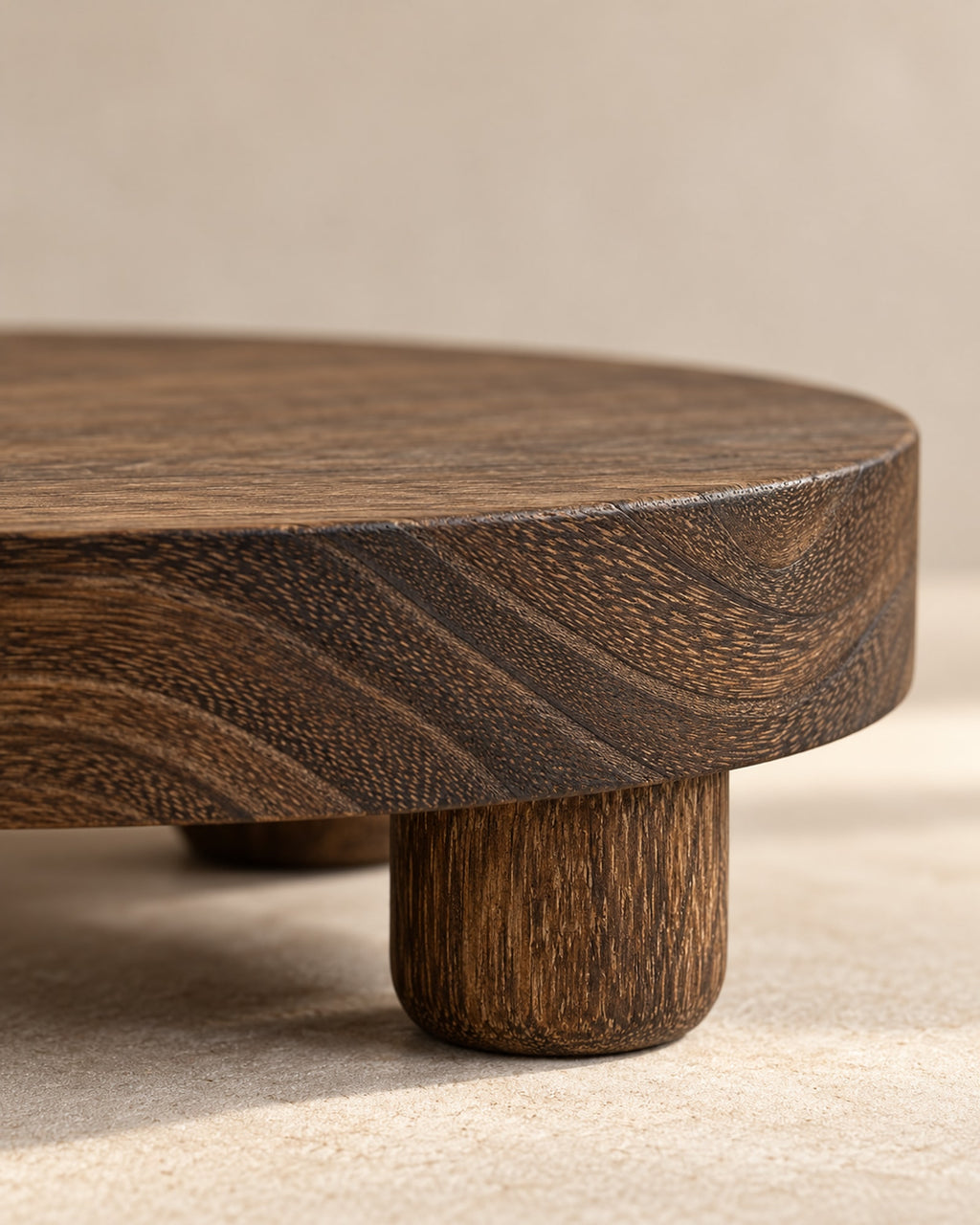 Close-up of the wood grain and a round foot of the riser.