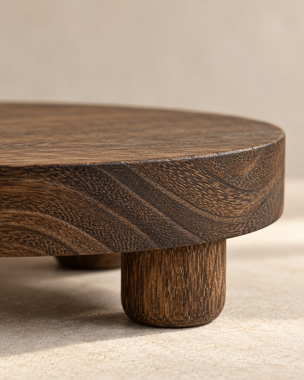 Close-up of the wood grain and a round foot of the riser.