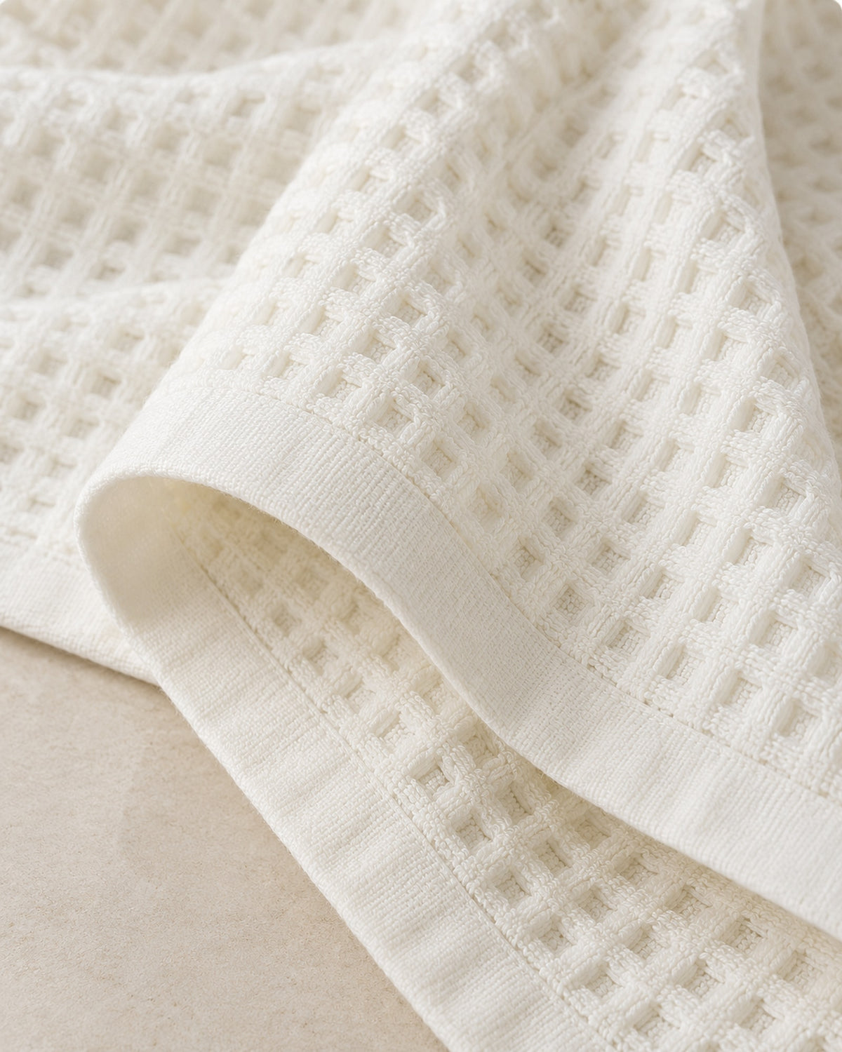 Close-up of the honeycomb waffle texture and hem.