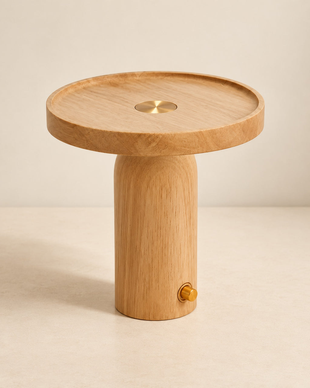 Wooden cordless table lamp with a round flat top on a warm off-white surface.